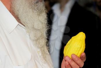 The Jewish holiday of Sukkot. Ritual fruit - citrus in the buyer's hand