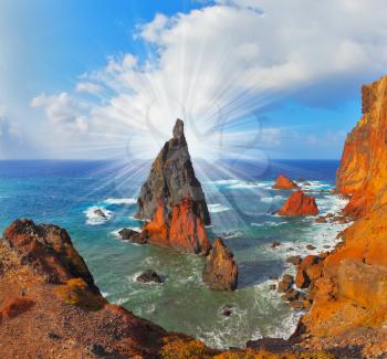 Atlantic storms. Colorful pinnacles lit sunset. Arid eastern tip of the island of Madeira