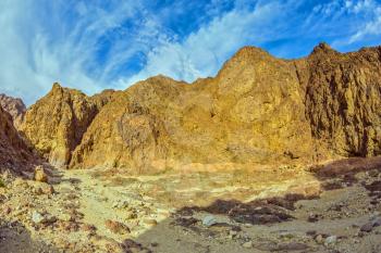 Picturesque and multi-color Black canyon in ancient Eilat mountains. Israel in January