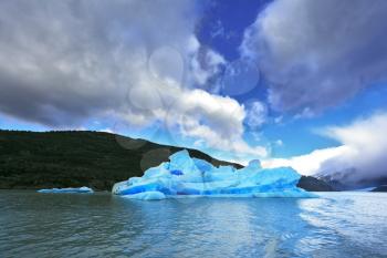 National Park Torres del Paine in Chilean Patagonia. Blue ice iceberg reflected in the lake Gray