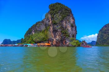 Fantastic island. Island-rock, covered with tropical greenery, among warm Andaman Sea