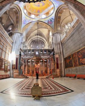  Huge beautifully decorated hall in front of the Edicule. Hall is  lit sunlight through windows in the domed ceiling and lamps. Church of the Holy Sepulcher in Jerusalem. The picture was taken Fisheye