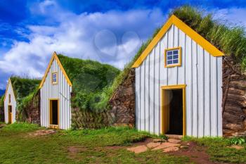 Houses are roofed by the turf and grass. The recreated village -  museum of first settlers in Iceland.  Village of ancestors