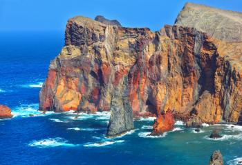 Arid eastern tip of the island of Madeira. Atlantic storms. Colorful pinnacles lit sunset