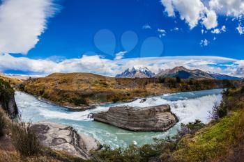 Chile, Patagonia, Paine Cascades. Torres del Paine National Park - Biosphere Reserve. Rocky ledges Paine river forms a cascading waterfalls