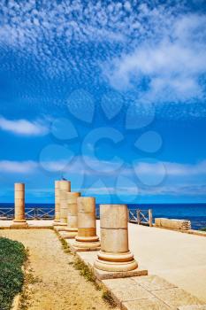Ancient columns from the Roman period on the coast. National Park Caesarea, Israel