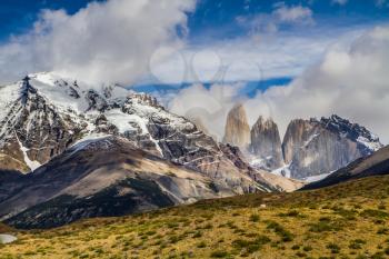 Summer in the south of Chile. The famous Torres rocks in Torres del Paine National Park. The concept of extreme and active tourism