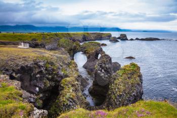 Travel to Iceland in the summer. Picturesque fancy fantastic coastal cliffs Arnastapi