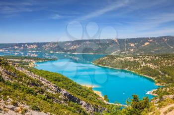  Canyon of Verdon, Provence, May. Picturesque lake with turquoise water among wooded hills

