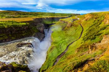  Grand Golden Waterfall on the Hvitau River.  The most picturesque waterfall in Iceland - Gullfoss. The concept of extreme and phototourism