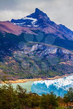  Patagonia, Argentine Province of Santa Cruz. Unique lake and fantastic glacier Perito Moreno,  in a mountain valley. The concept of  exotic and extreme tourism