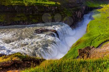  The most picturesque and popular waterfall in Iceland - Gullfoss. Grand Golden Waterfall on the Hvitau River. The concept of extreme and phototourism