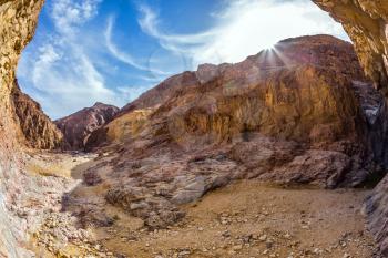 Picturesque and multi-color Black canyon in ancient Eilat mountains. Israeli warm winter. Photo taken fisheye lens