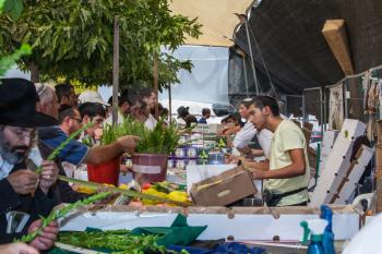 JERUSALEM, ISRAEL - OCTOBER 8, 2014: Sukkot in Israel. Traditional holiday market in Jerusalem. Religious Jews buy items, necessary during the holiday
