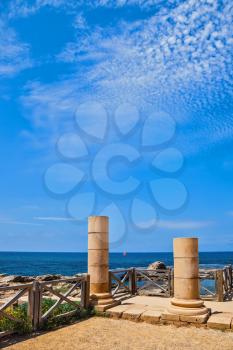 Ancient columns from the Byzantine period on the Mediterranean coast. National Park Caesarea, Israel