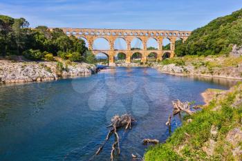 Provence, spring sunny day. Three-tiered aqueduct Pont du Gard - the highest in Europe. The bridge was built in Roman times on  river Gardon