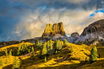 Travel in the Dolomites. Last sunny day of fall. To pass Faltsarego approaching snowstorm. Concept of active and extreme tourism