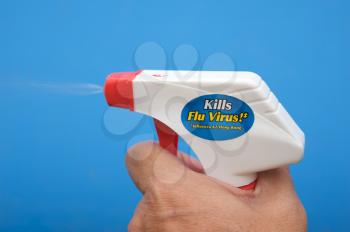 Royalty Free Photo of a Spray Bottle Being Sprayed