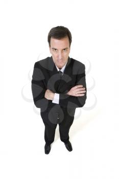 Royalty Free Photo of a Stern Businessman With His Arms Crossed