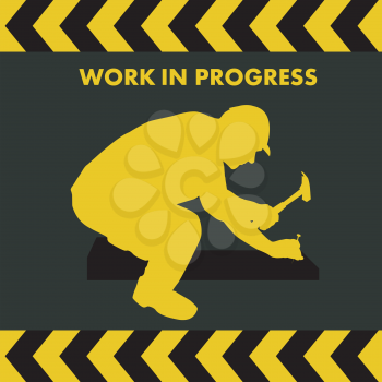 WORK IN PROGRESS sign with worker silhouette with hammer and nail