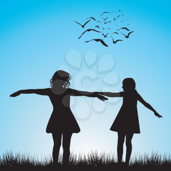 Silhouettes of two girls playing outdoor