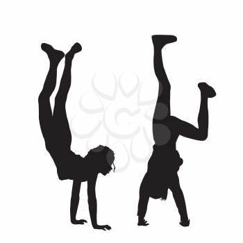 Kids silhouettes standing upside down on their hands