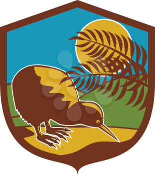 Illustration of a kiwi bird viewed from the side set inside shield crest with moon fern and mountain in the background done in retro style. 