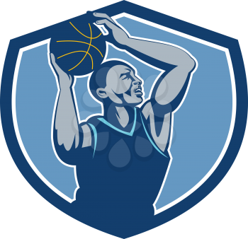 Illustration of a basketball player with ball rebounding lay up set inside shield crest viewed from the side done in retro style.