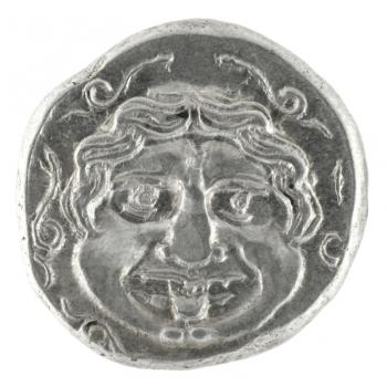 Royalty Free Photo of Medusa on ancient Greek half drachm from 300 BC isolated in white