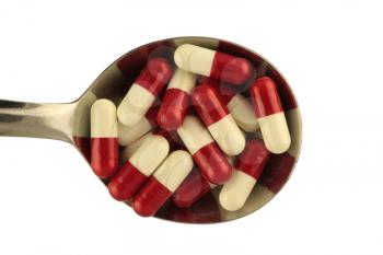 Royalty Free Photo of a Spoon With Pills