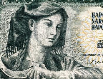 Farm woman with sickle on 5 Dinara 1968 banknote from Yugoslavia.