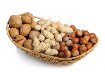 Royalty Free Photo of Walnuts, Hazelnuts and Peanuts in a Wicker Basket