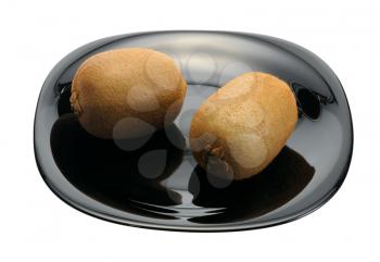 The pair of Kiwi on a black plate on a white background