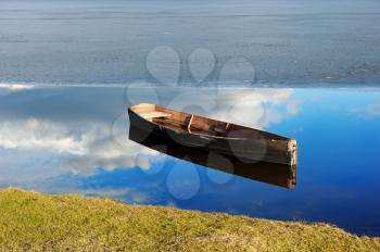 Royalty Free Photo of a Boat in a Water With Ice in the Background