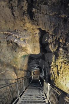 Royalty Free Photo of a Tunnel in the Rocks, Leading to the Tank of the Bronze Age on the Hill Megiddo (Israel)