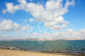 Royalty Free Photo of the Sea of Galilee in the Early Morning With Ripples on the Water and Clouds in the Sky