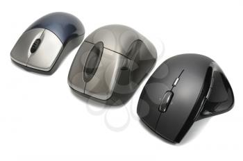 Modern wireless computer mouses on white background
