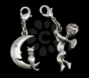 Royalty Free Photo of Cat and Moon Pendant and a Cupid Pendant