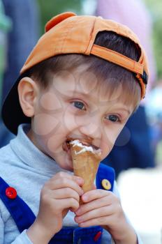 Royalty Free Photo of a Boy Eating Ice Cream
