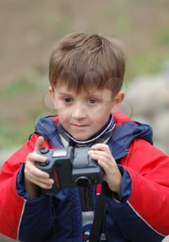 Royalty Free Photo of a Little Boy With a Camera