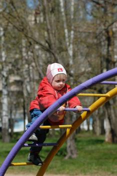 Royalty Free Photo of a Child Playing in a Park
