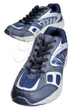 Dark blue sneakers, isolated on a white background.