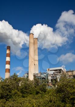Industrial power plant with smokestack