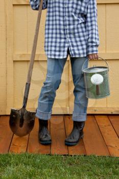 Royalty Free Photo of a Woman Holding Gardening Tools