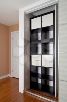 Built-in closet with sliding door shelving storage organization solution, empty shelves