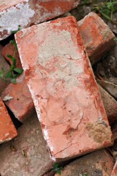 old obsolete bricks on the ground closeup
