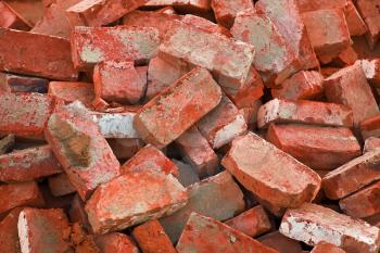 bg of heap of red bricks in stack