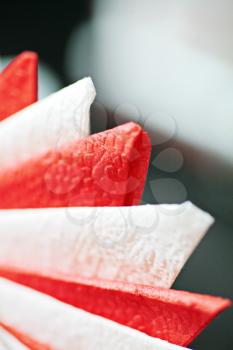 A stack of red and white paper napkins with copy space.