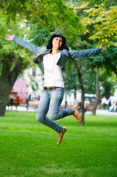 Royalty Free Photo of a woman jumping into the air.