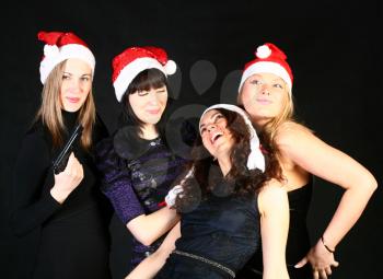 four 20-25 years  women  friends having fun on a christmas party